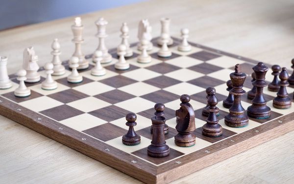 wooden chess board and pieces